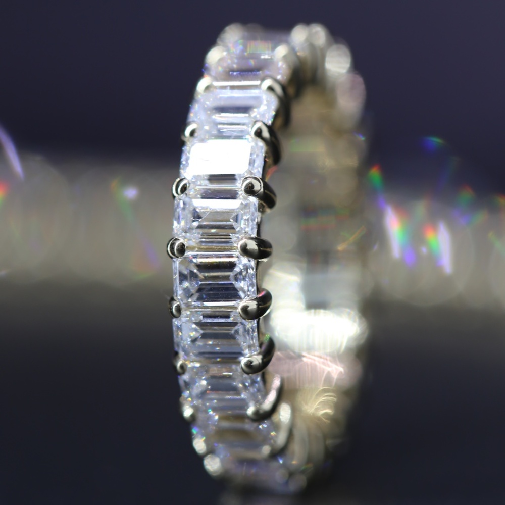 4 carat emerald cut diamond eternity band yellow gold